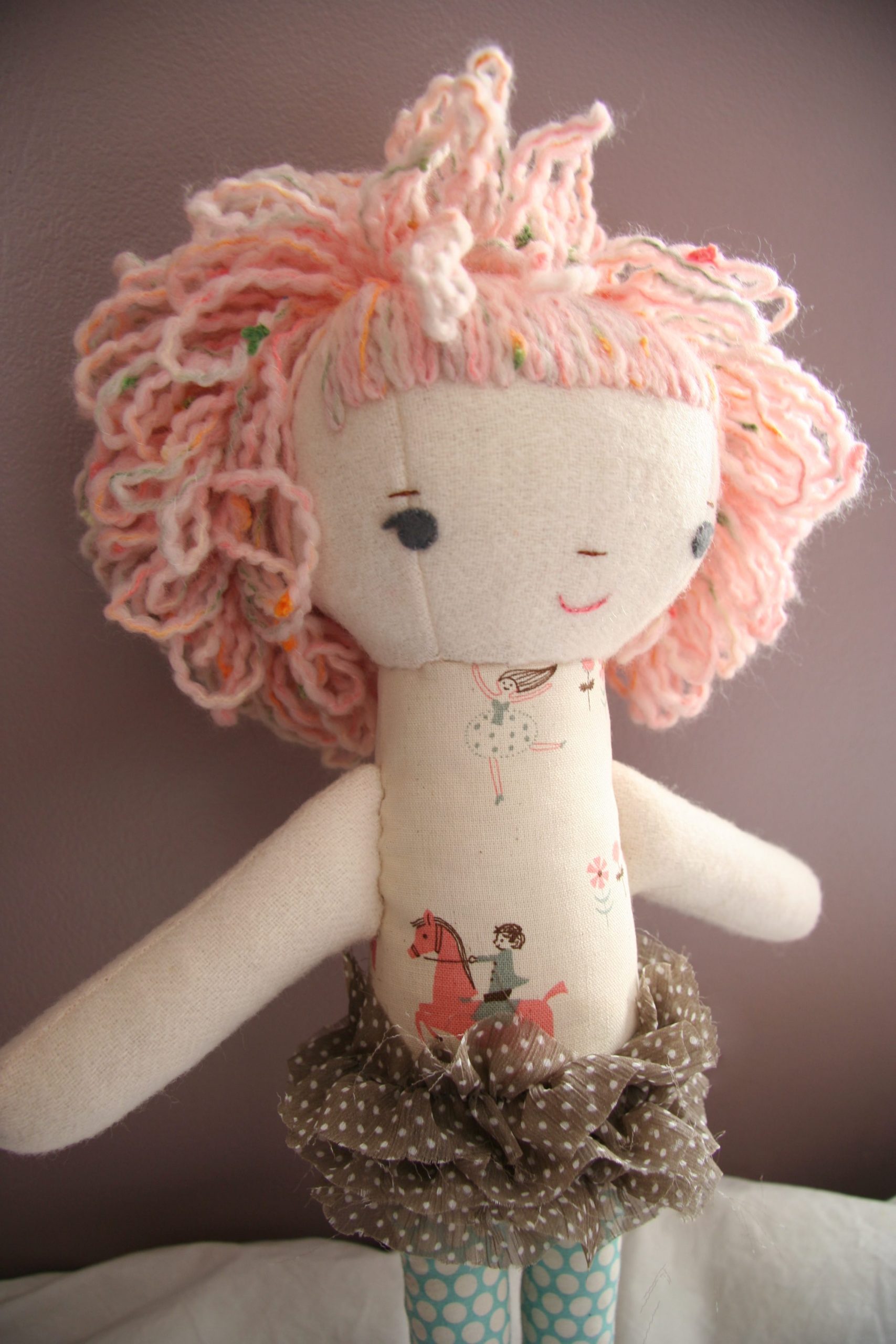 pink puffy curly haired doll